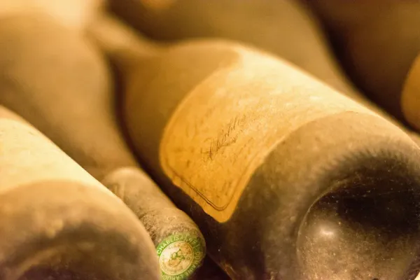 Old bottle of Chablis with dust on